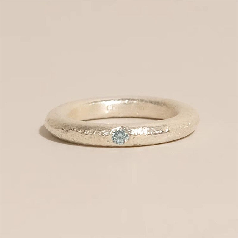 Ice Blue Accent Textured Silver Ring